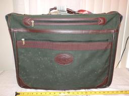 Orvis suitcase. This orvis gentleman's bag has spotting on one side but would possibly clean up.