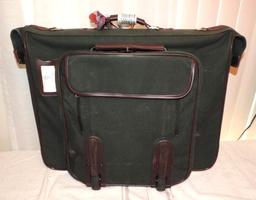 Orvis suitcase. This orvis gentleman's bag has spotting on one side but would possibly clean up.