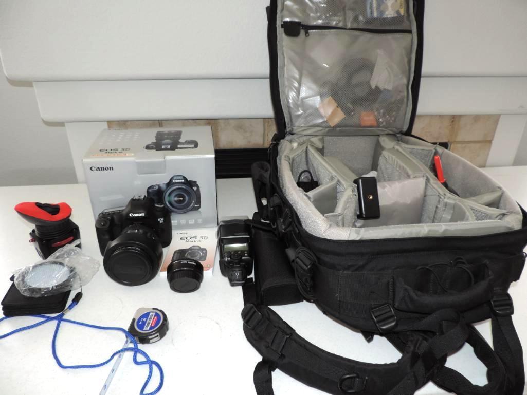 Canon EOS 5D mark III camera with 24-105mm lens and lots of accessories.