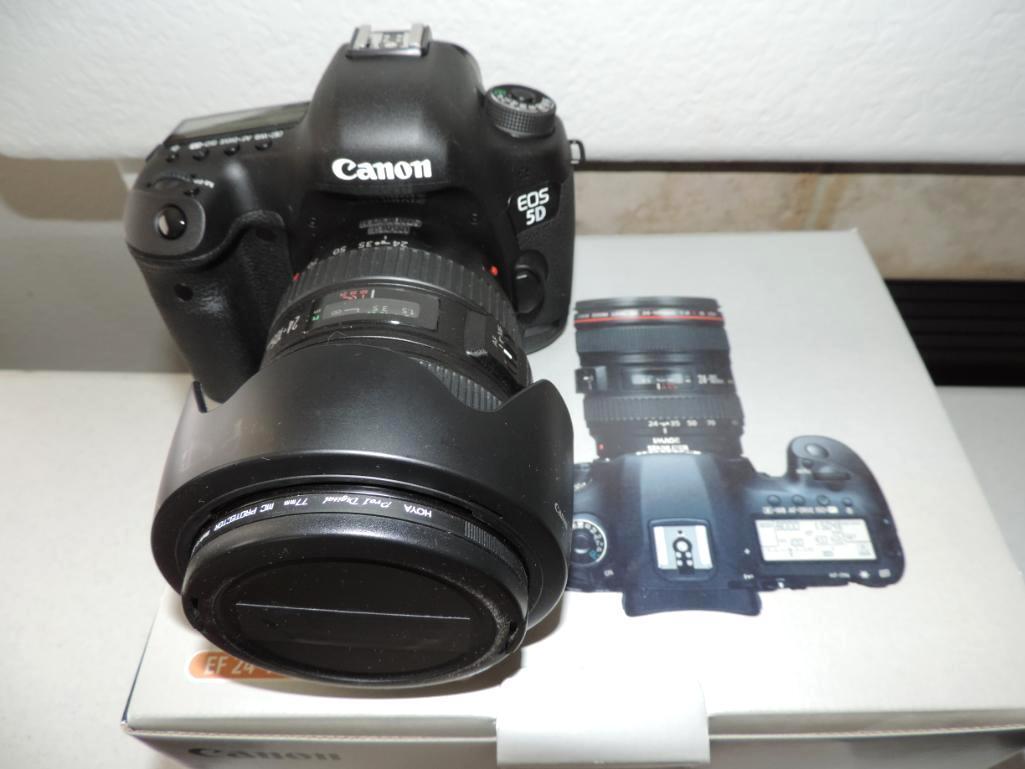 Canon EOS 5D mark III camera with 24-105mm lens and lots of accessories.