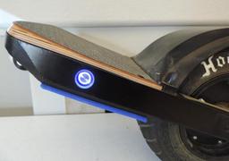 One Wheel + skateboard with charger.