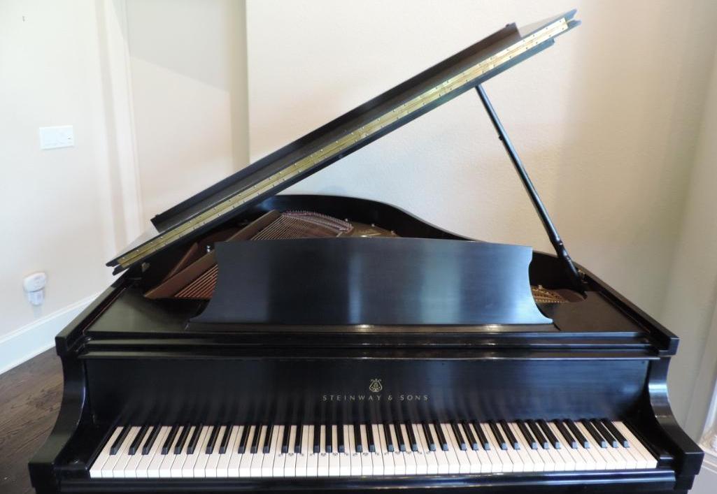 Beautiful black Steinway and Sons grand piano.