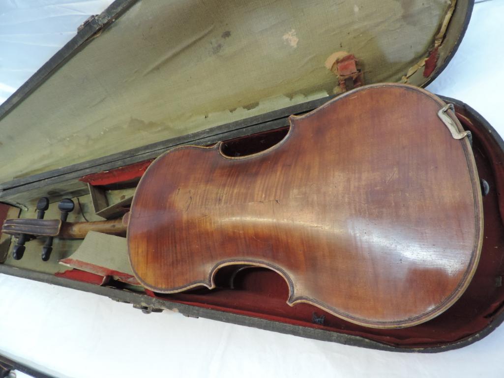 Early violin with wood case and bow.