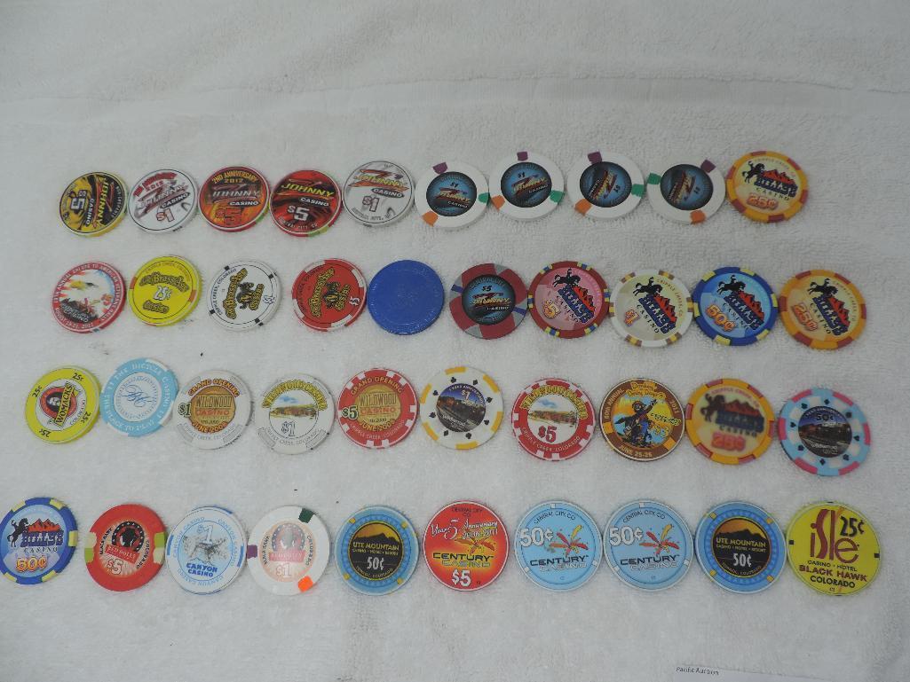 Forty collector casino chips.