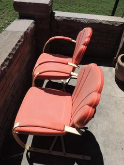 Four vintage metal patio chairs.