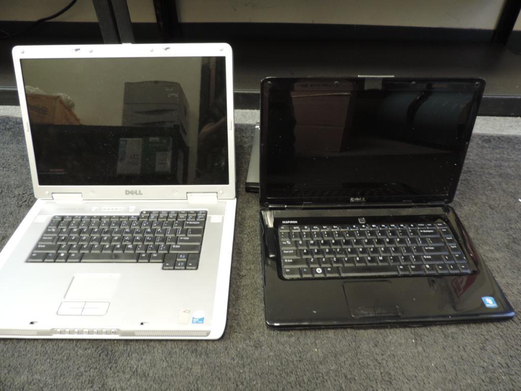 Four Dell laptops for parts or repair.