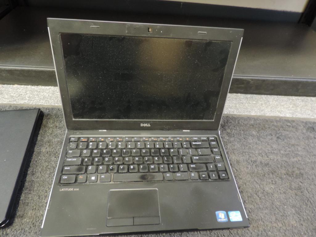 Four Dell laptops for parts or repair.