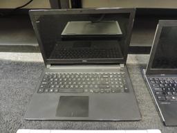 Four Dell laptops for parts or repair.