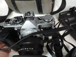 Olympus OM-2 camera with accessories.