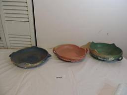 Three Roseville candy dishes.