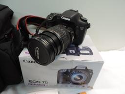 Canon EOS 7D camera with accessories.