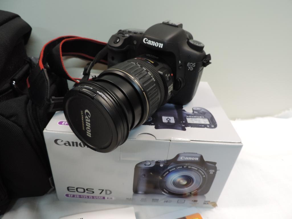 Canon EOS 7D camera with accessories.