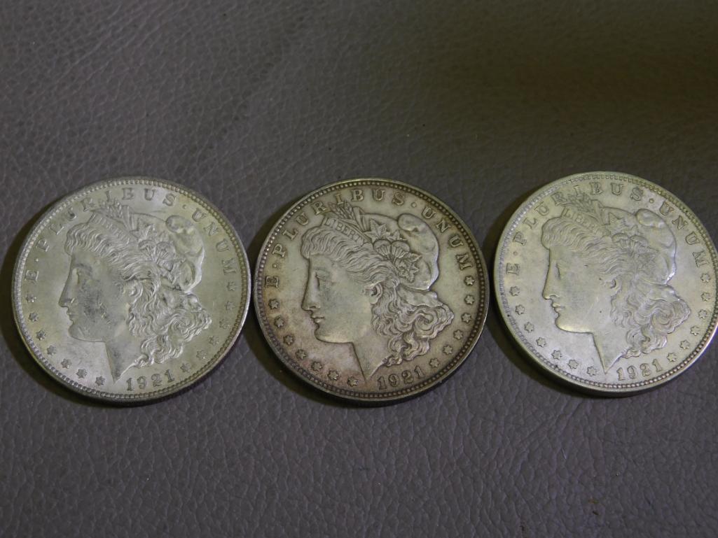 Three 1921 Morgan silver dollar coins