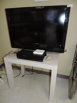 42" Polaroid TV with VCR/DVD player and table.