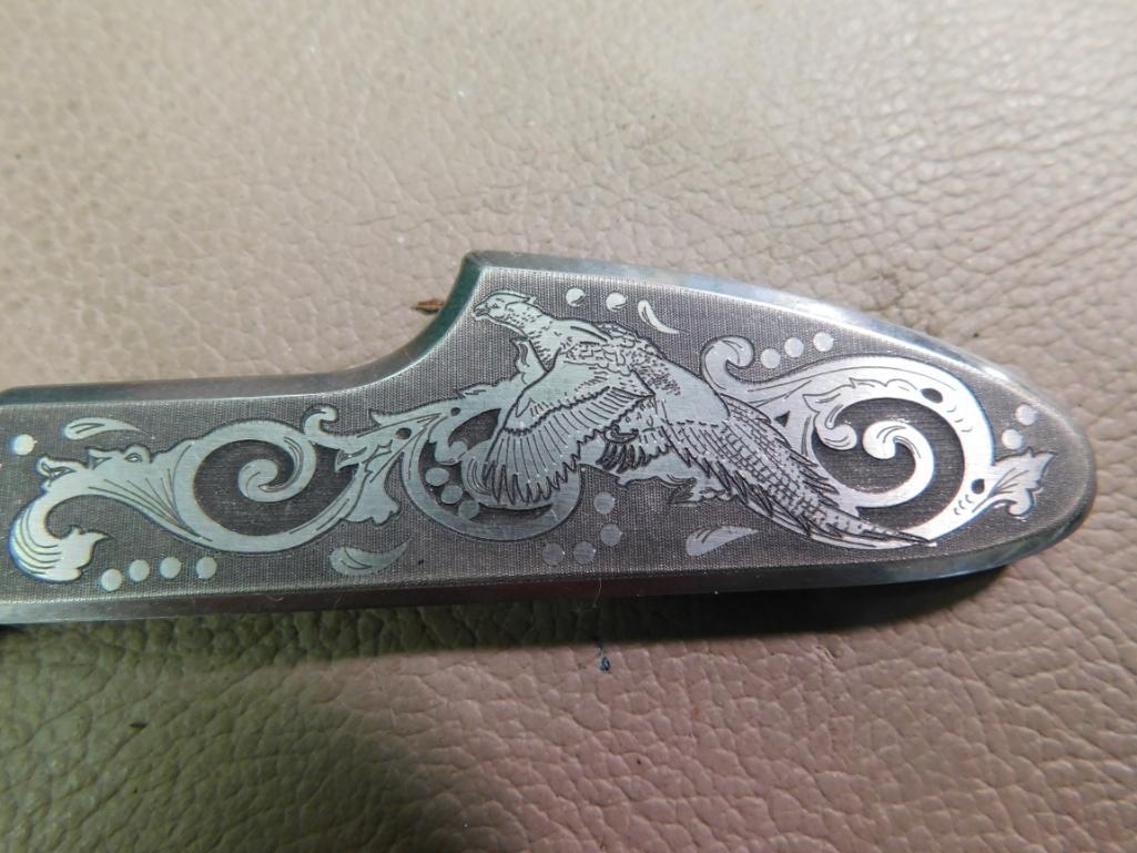 Famas engraved hawkbill knife