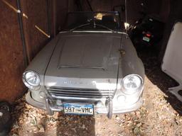 Silver 1967 Datsun 1600 Convertible showing 21K Miles