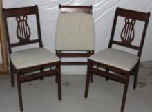 Three Folding Upholstered Wood Chairs