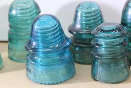 Nine Colored Glass Hemingray Insulators