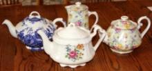 Three Beautiful Floral Porcelain Teapots and Small Pitcher