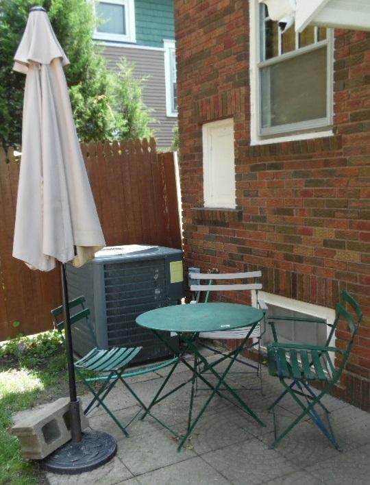 outdoor table, 3 chairs, and umbrella and stand